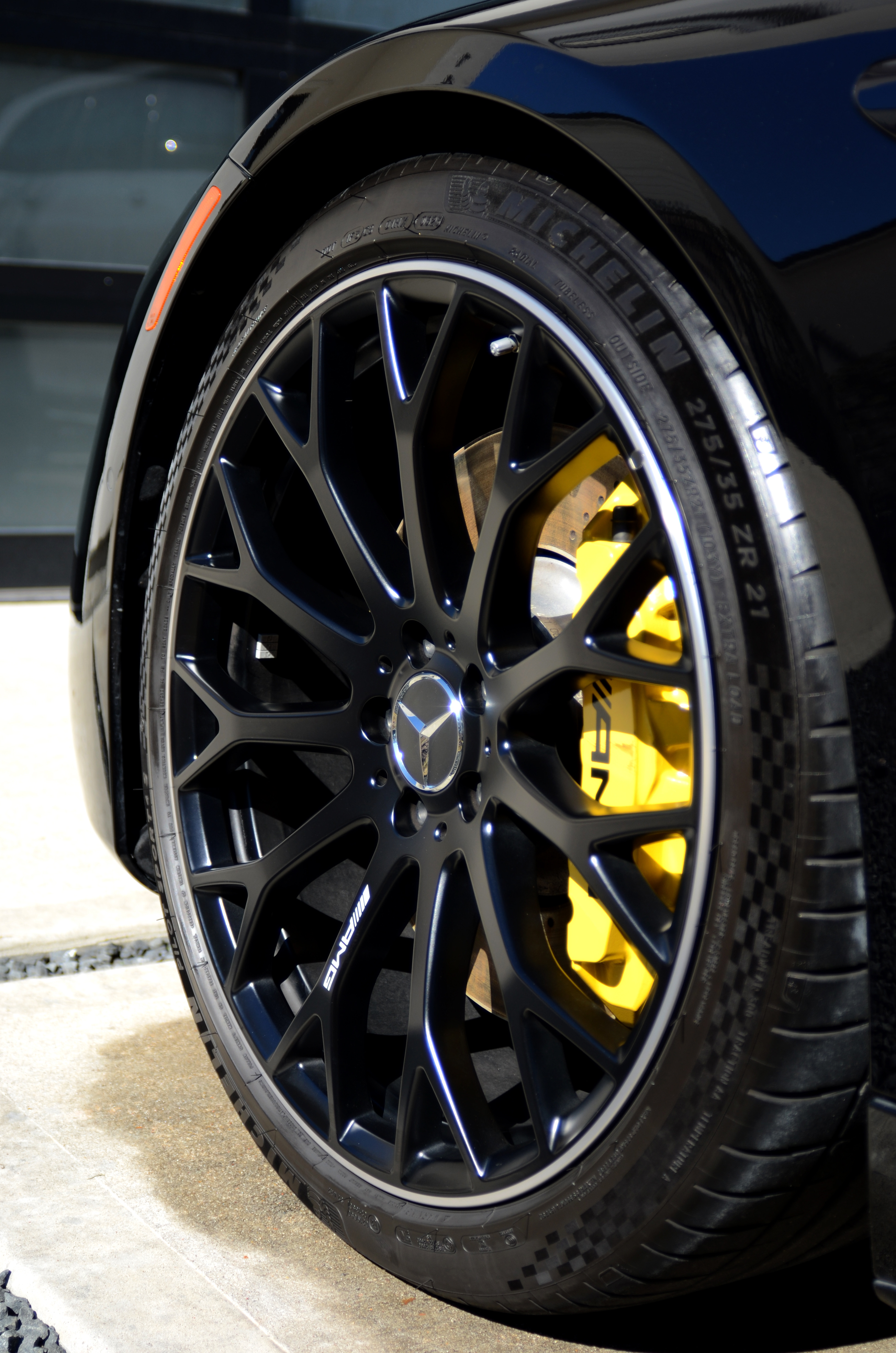 Mercedes AMG wheel detail — yellow brake caliper
